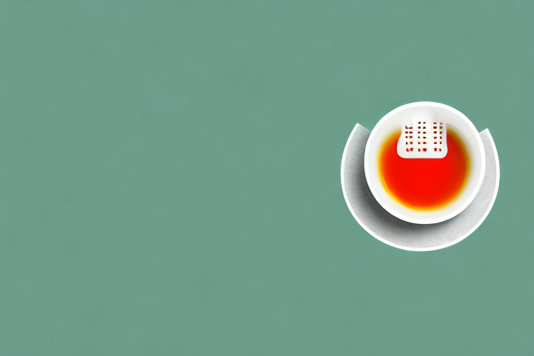 A cup of tea with a green tea bag and steam rising from it